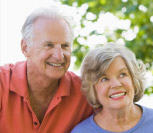 A woman with information about the new Seniors' help hotline at 877-771-2677.