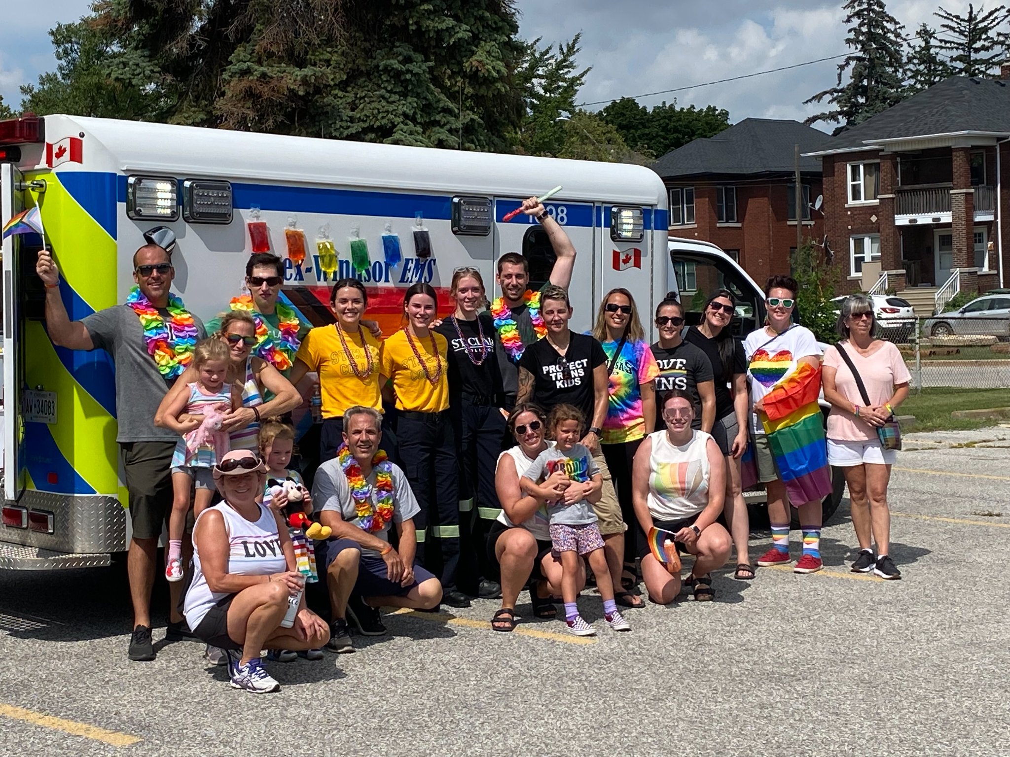 Essex-Windsor EMS Paramedics and an ambulance at a Pride Parade