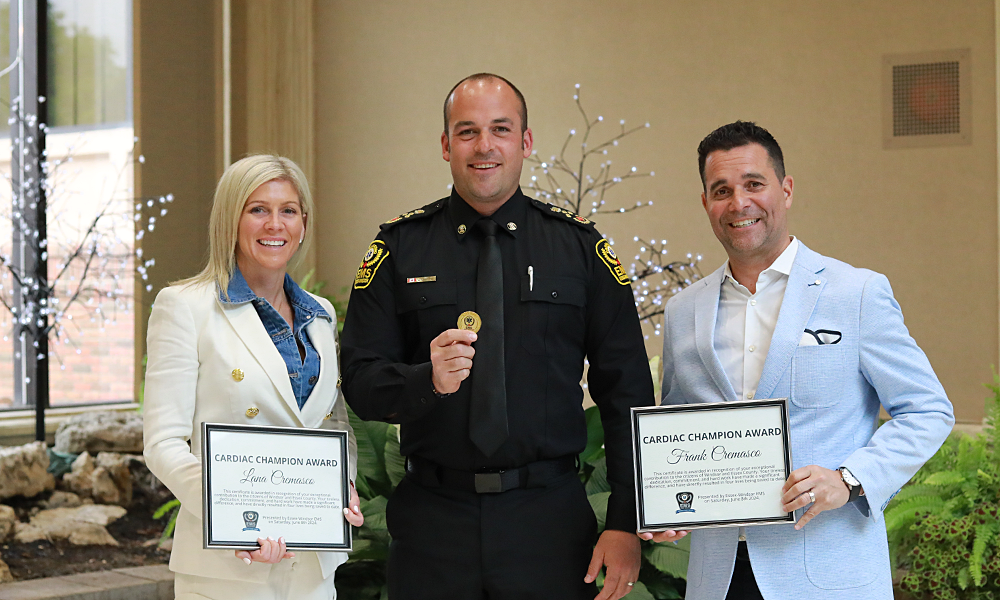 Lana and Frank Cremasco receive Cardiac Champion certificates and a meritous service coin from Chief Justin Lammers.