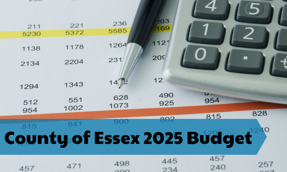 A close up view of a spreadsheet with numbers and a calculator and pen.