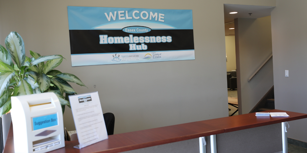The entrance to the Homelessness Hub with a reception desk and welcome sign