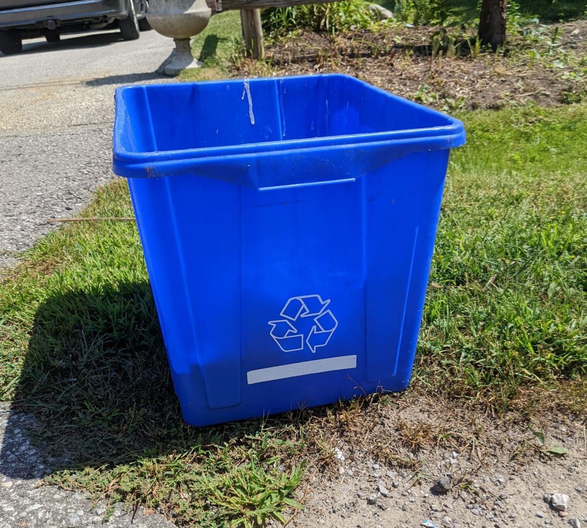 a blue recycling bin