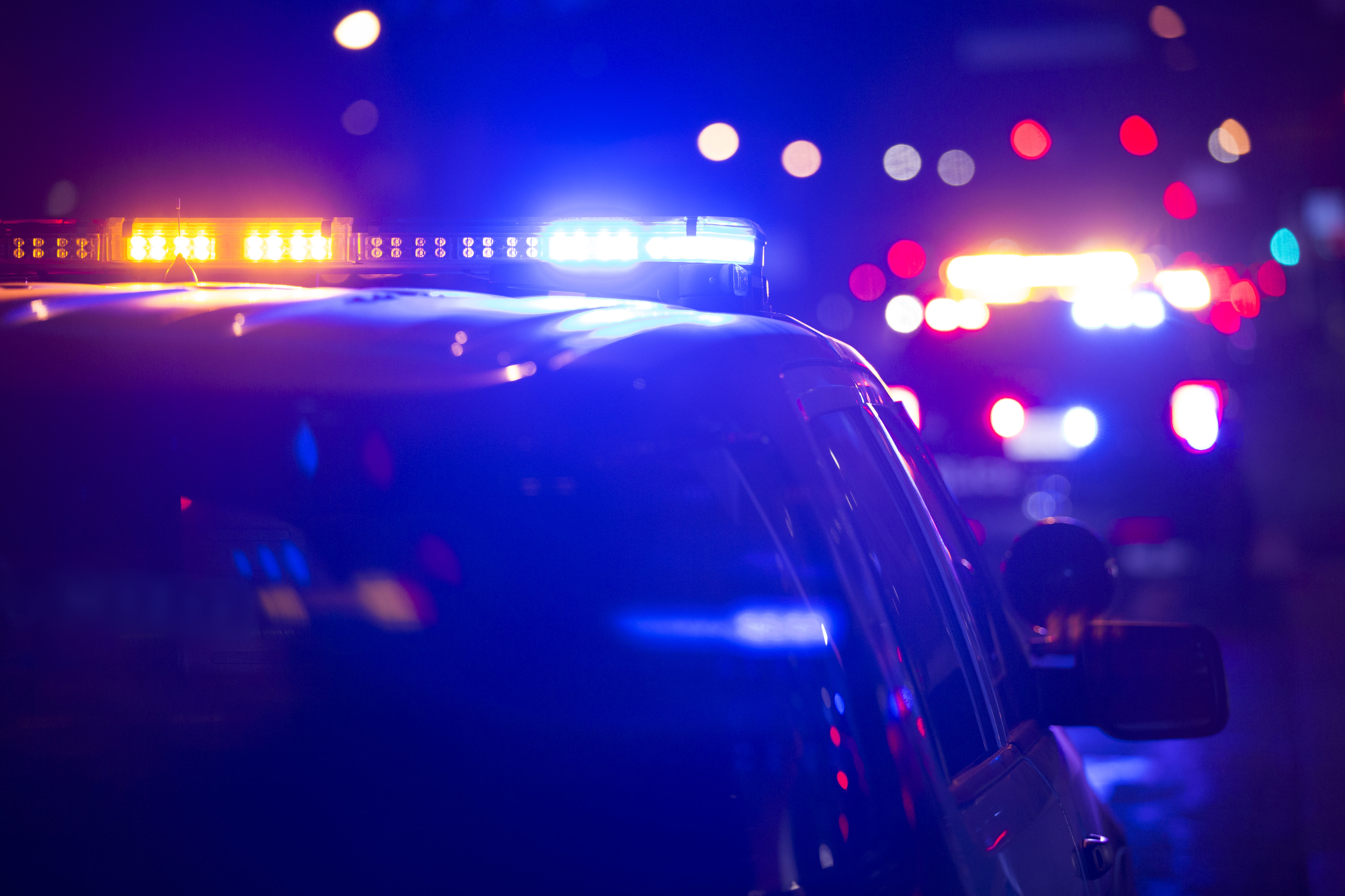 Police emergency lights flashing at night