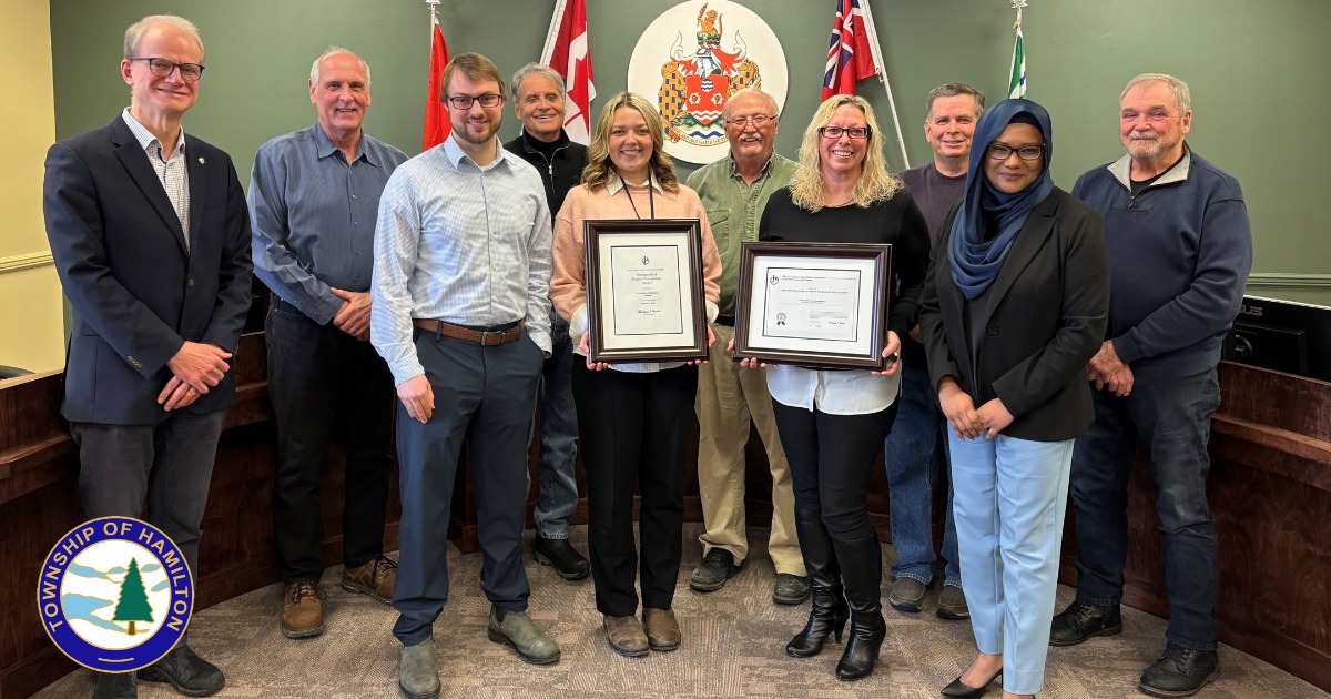 Township of Hamilton staff posing with Distinguished Budget Presentation Award for 2025 in council chambers