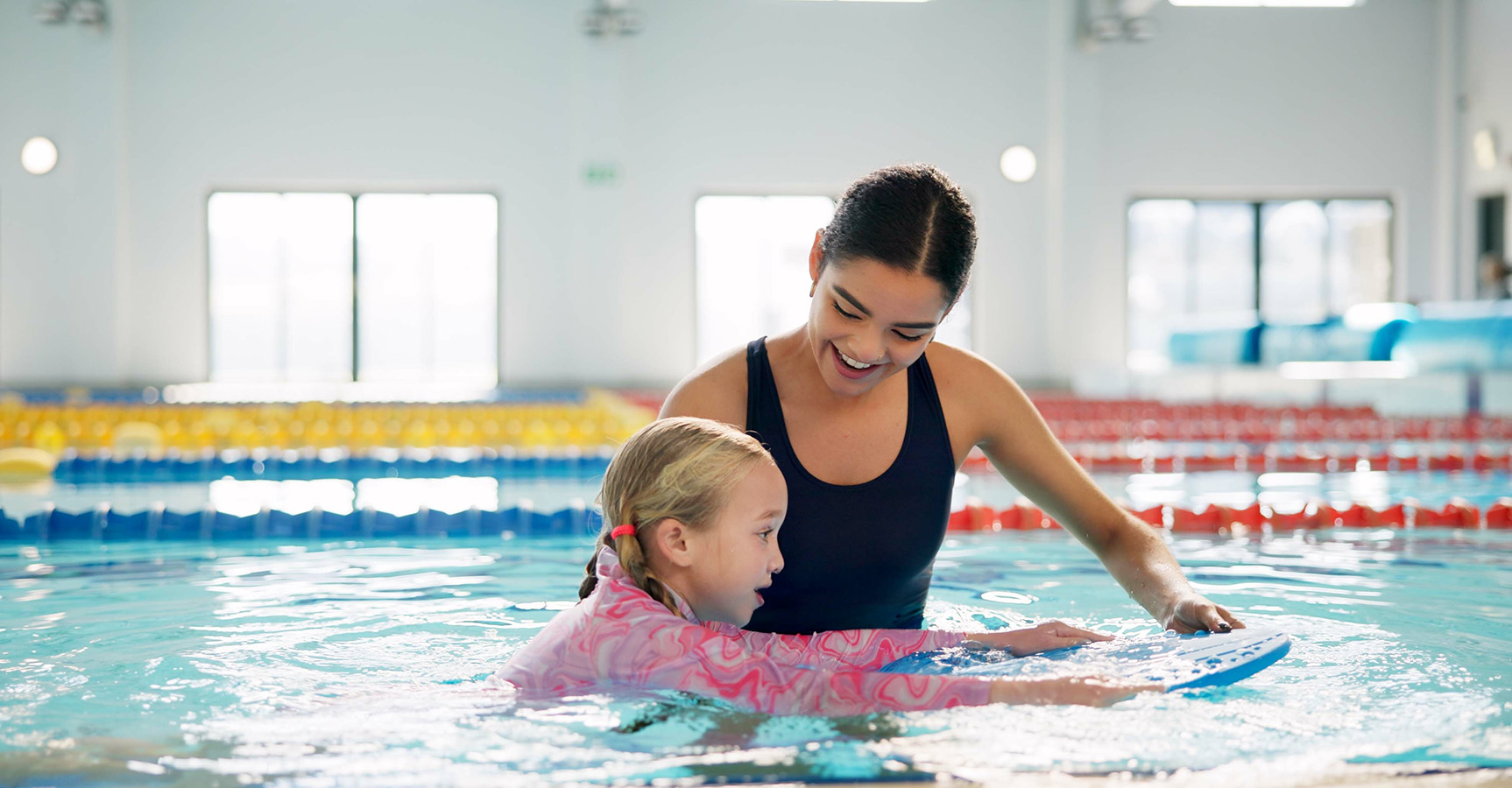 Swim instructor with student