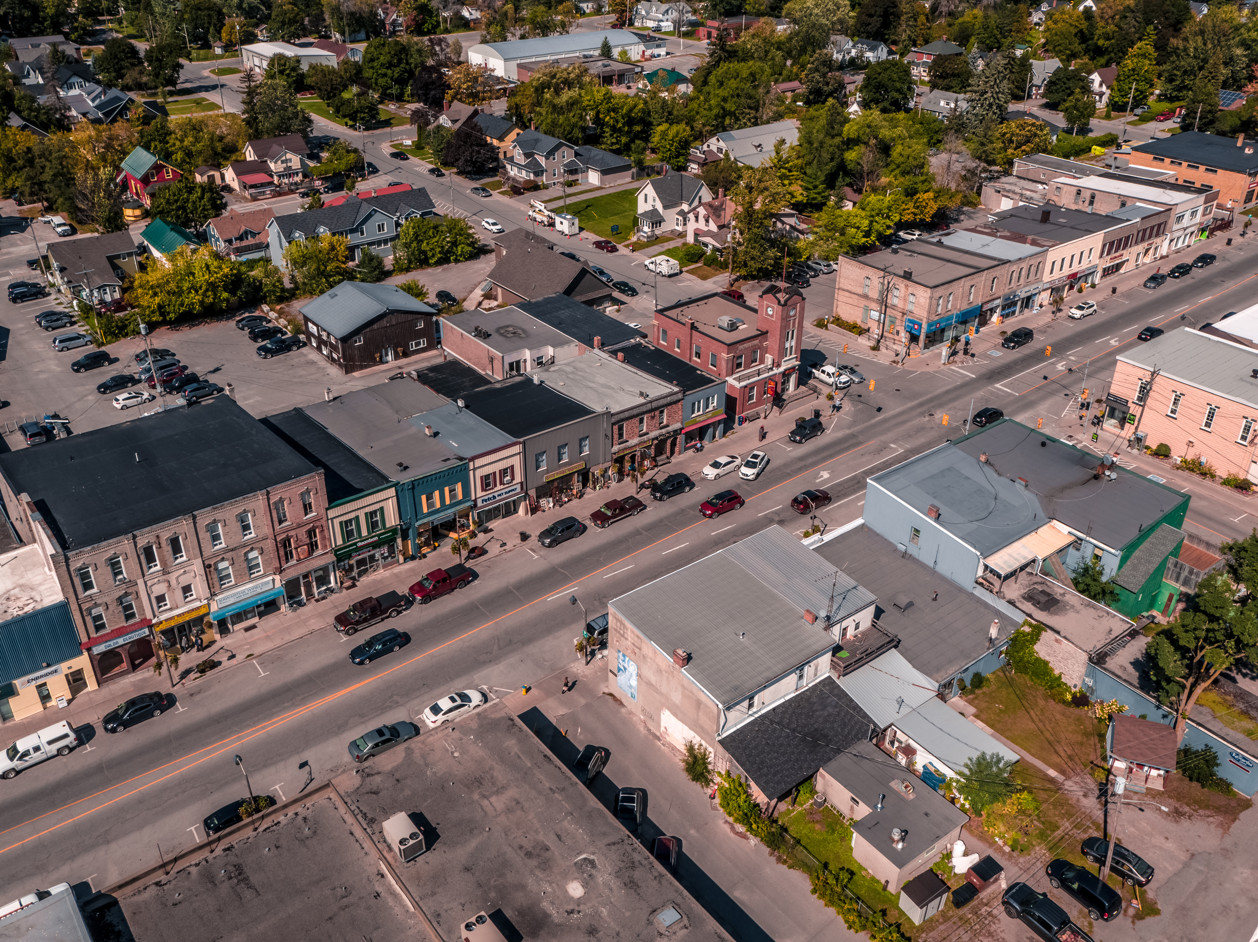 Aerial view of Fenelon Falls Downtown with buildings, cars and trees
