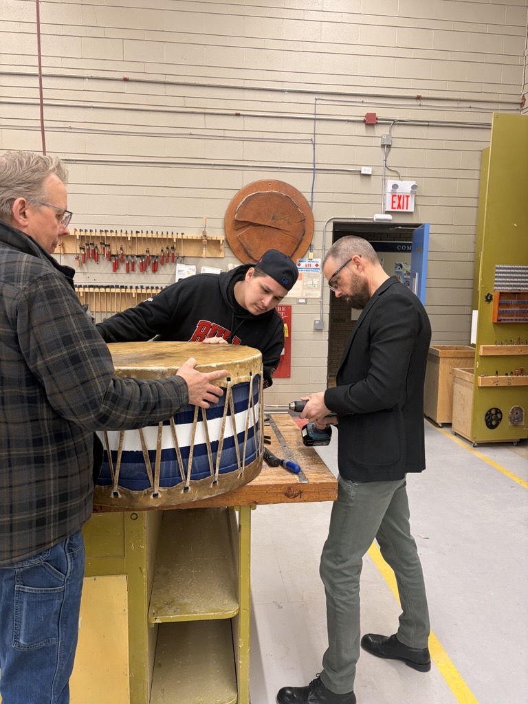 Keyano College President taking part in a hands-on community activity with staff and students.