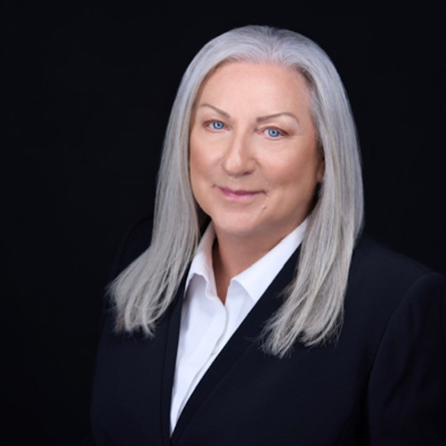 A headshot of Adele Thomson