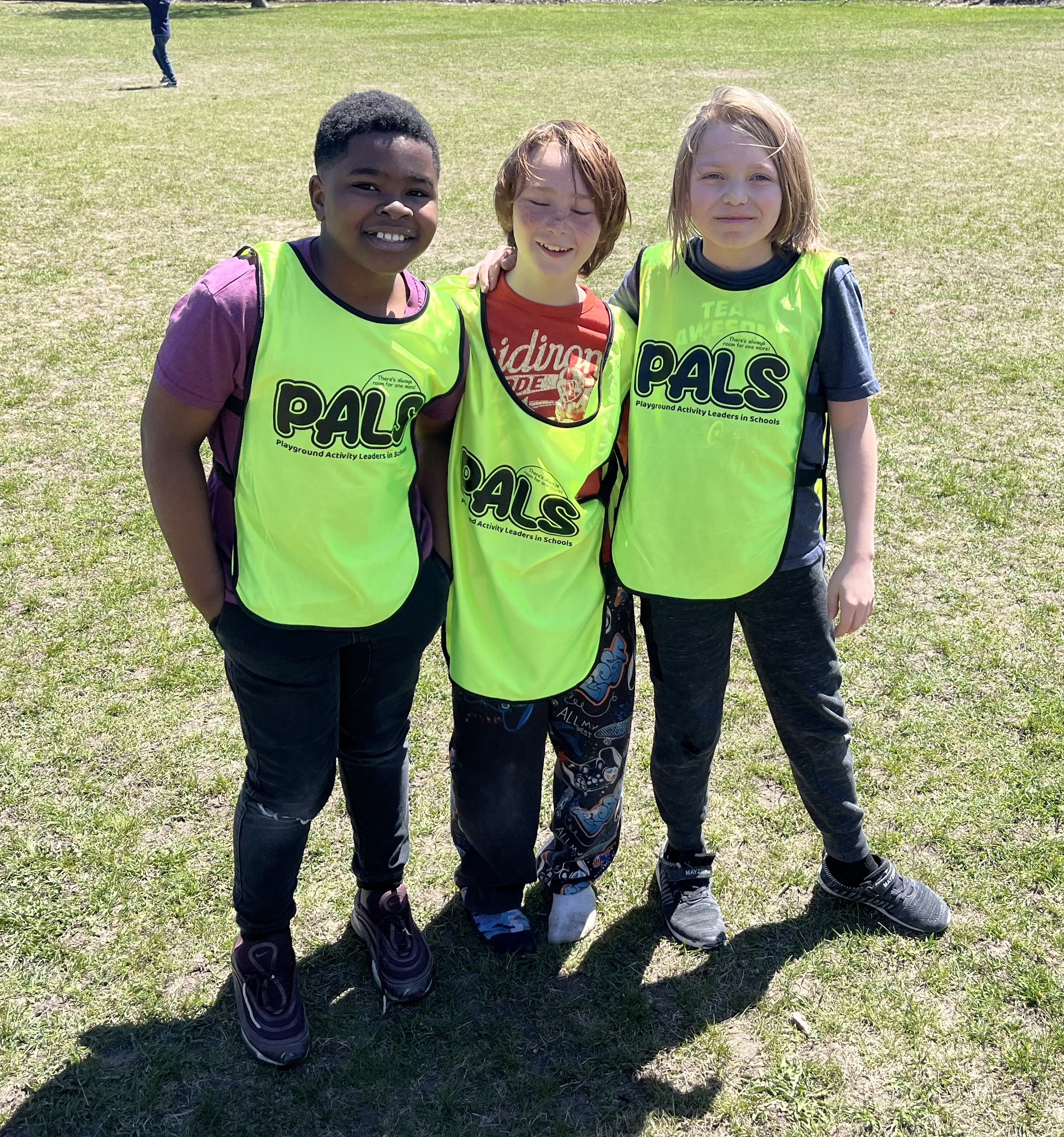 students in lime green pinnies