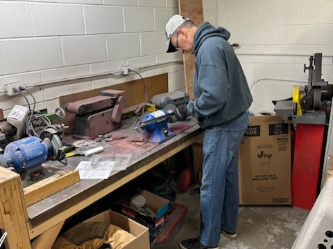 Man polishing metal