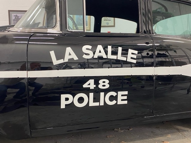 Black car with letters