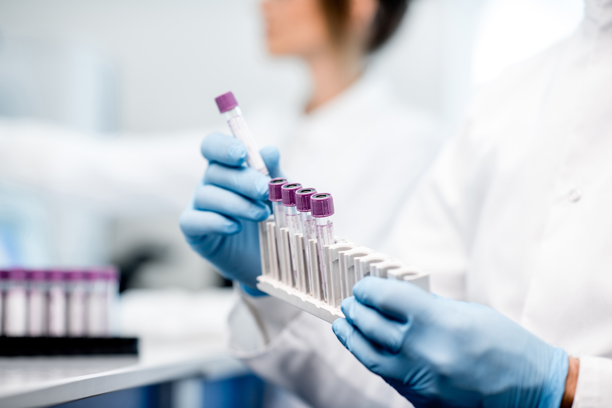 Clinical staff handling the test samples in the laboratory