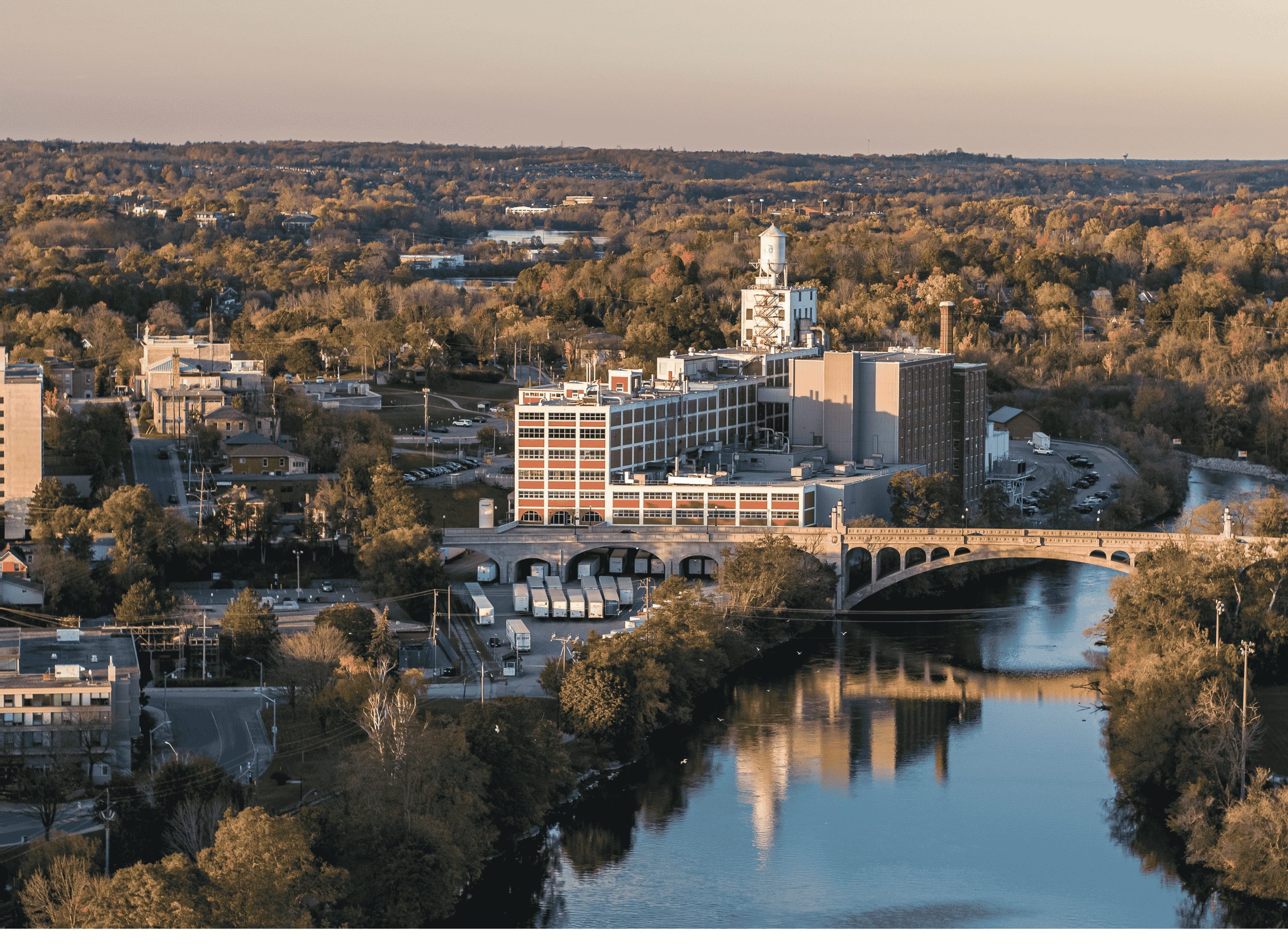 Fall drone photo showing the Quaker PepsiCo Plant in Peterborough with the Hunter Street Bridge in the foreground