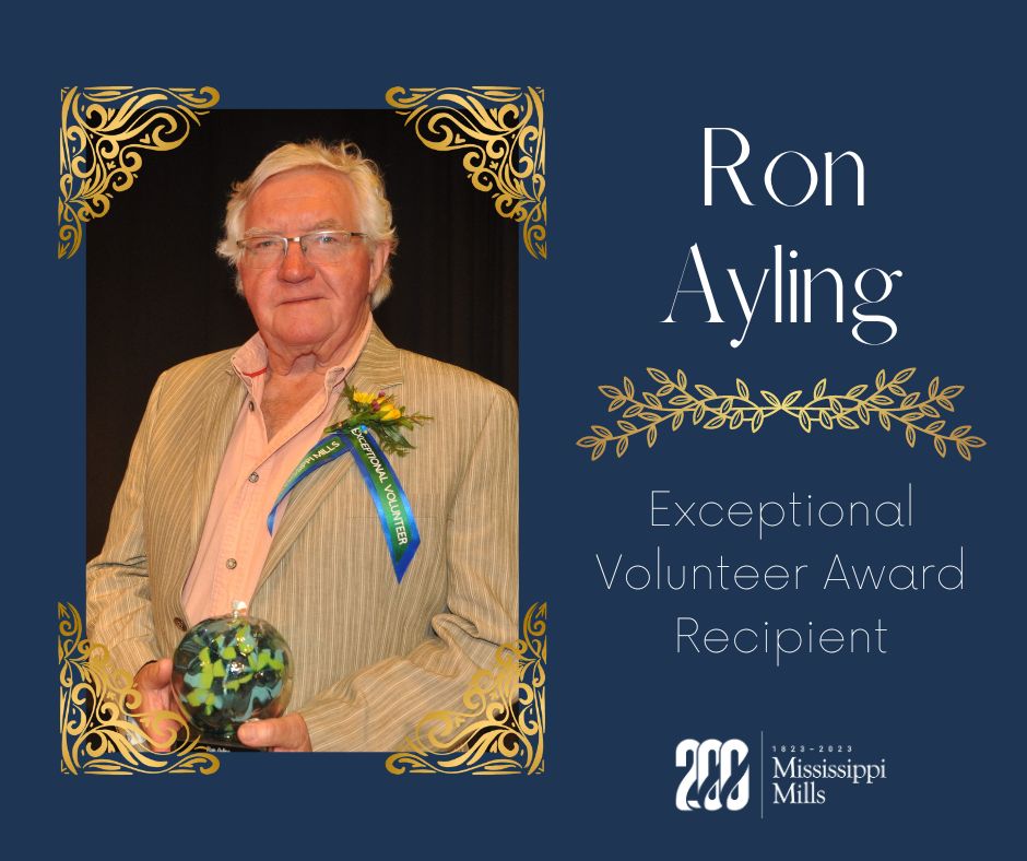 Man holding award graphic