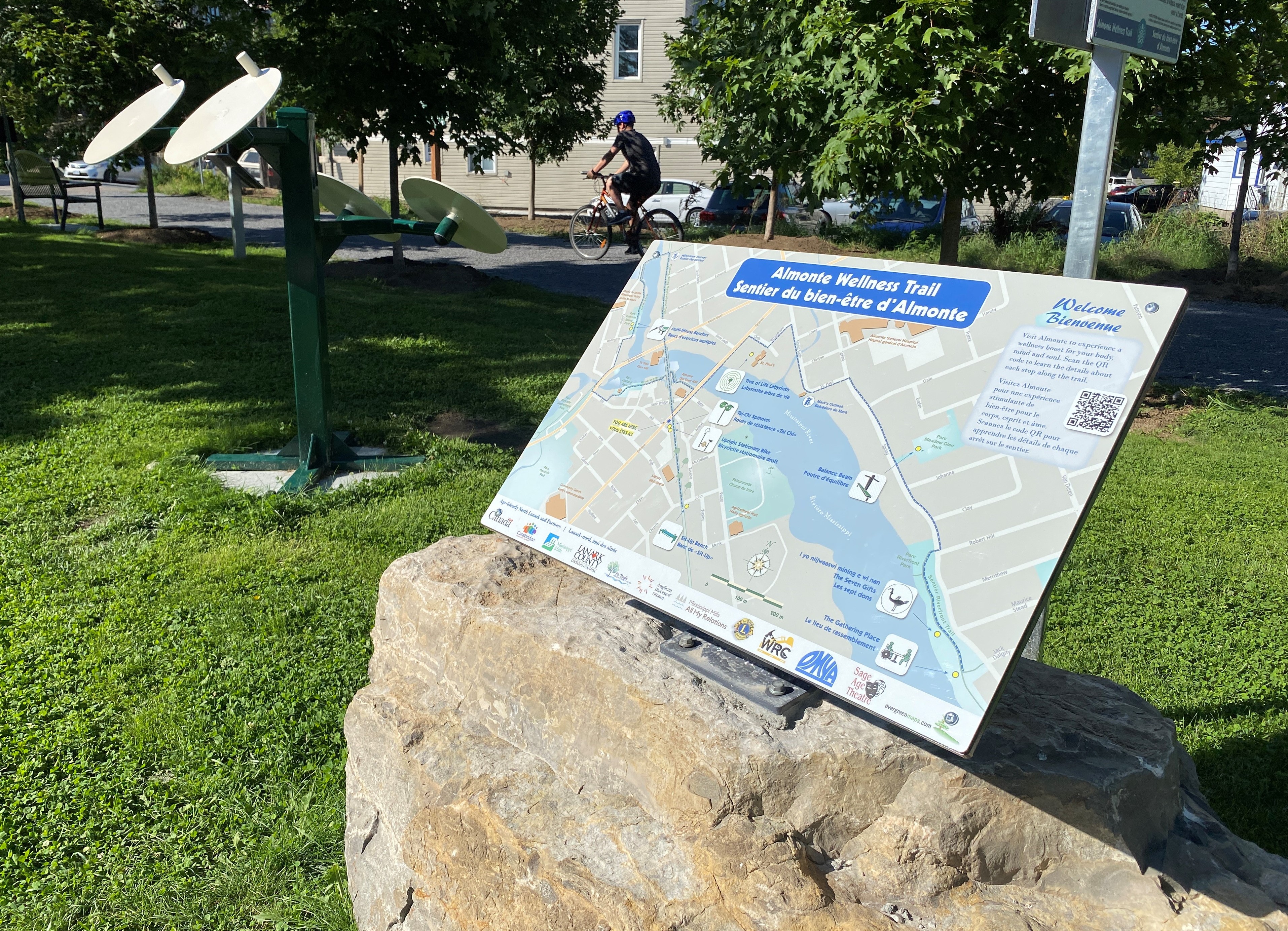 Photo of pathway showing a rock with a sign marked 'Almonte Wellness Trail'
