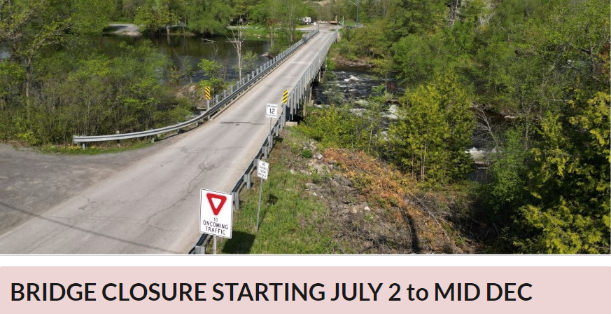 Photo of a bridge with trees and water surrounding it. Text below reads 'Bridge Closure July 2 to Dec'