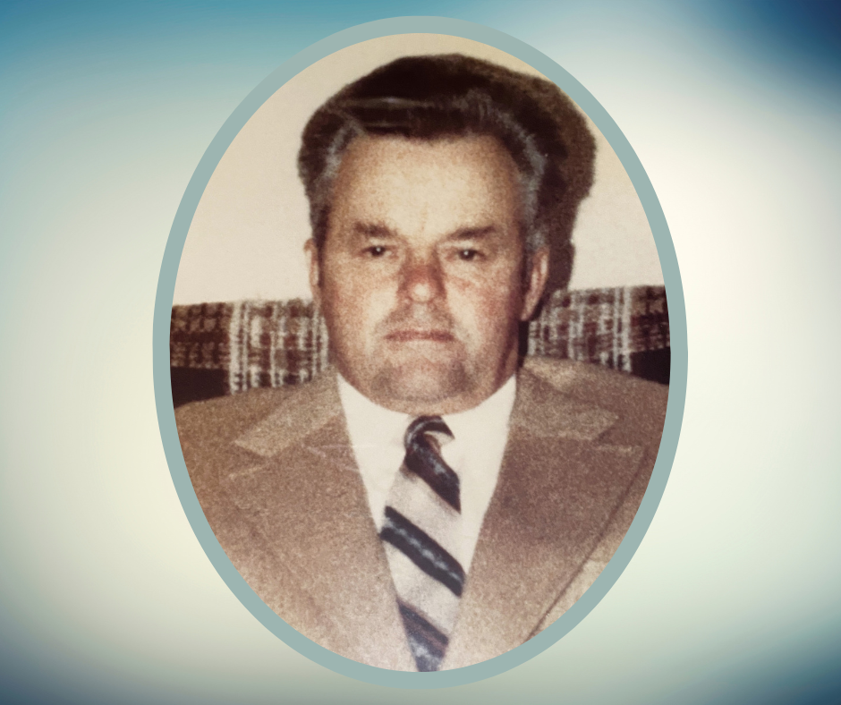 Blue and white gradient background with headshot of a man with graying hair and beige suit.