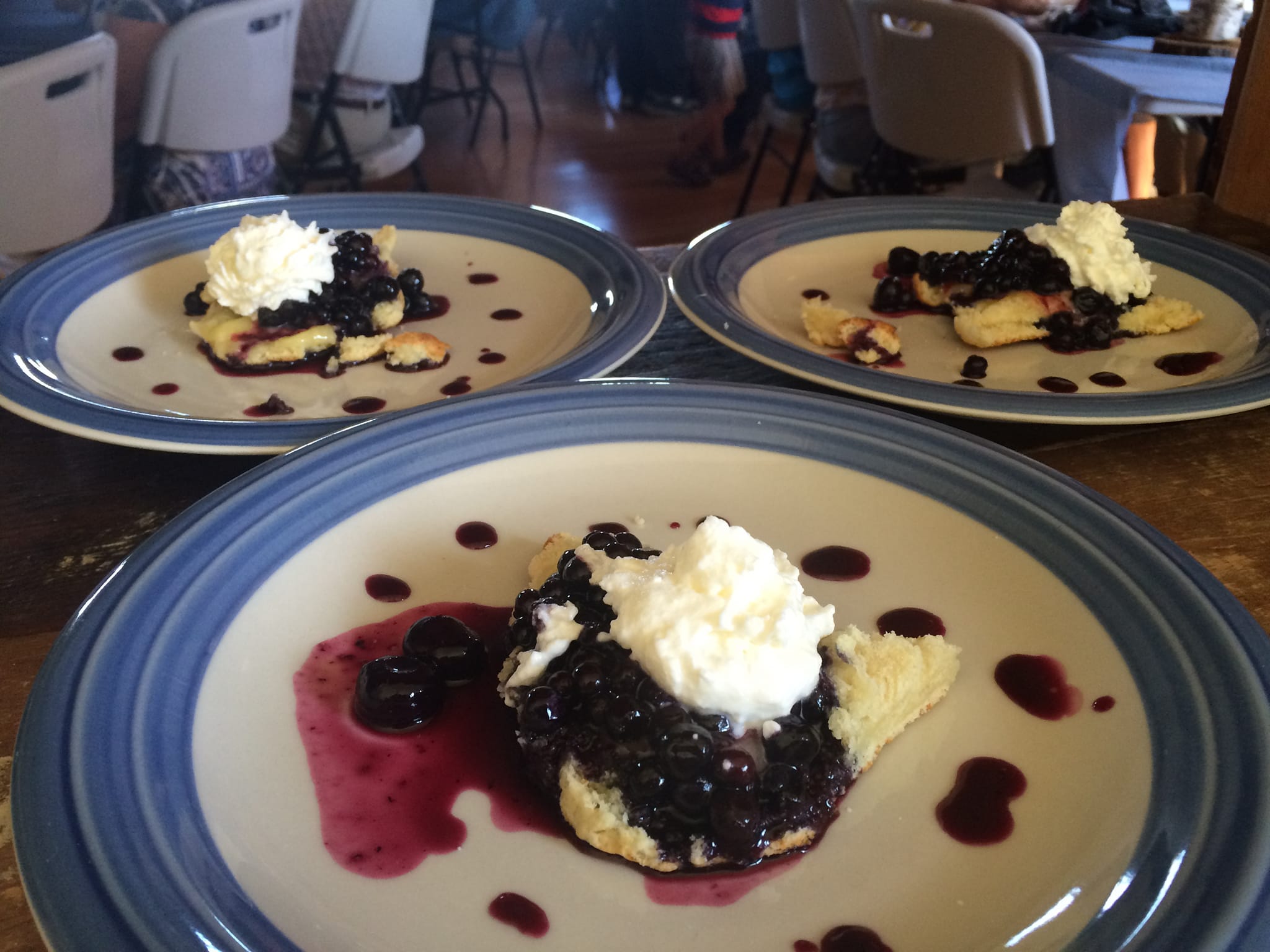 Close up photo of plates filled with blueberry shortcake