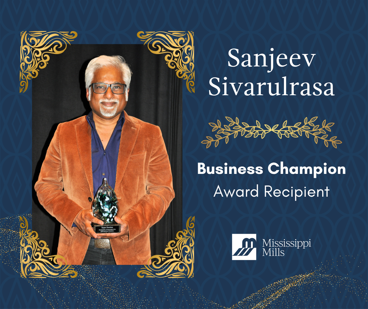 Navy background with gold accents displays a photo of a white haired Sri Lankan man with glasses, wearing a blue shirt and rust-coloured blazer and holding an award. White text reads 'Sanjeev Sivarulrasa - Business Champion Award Recipient.'