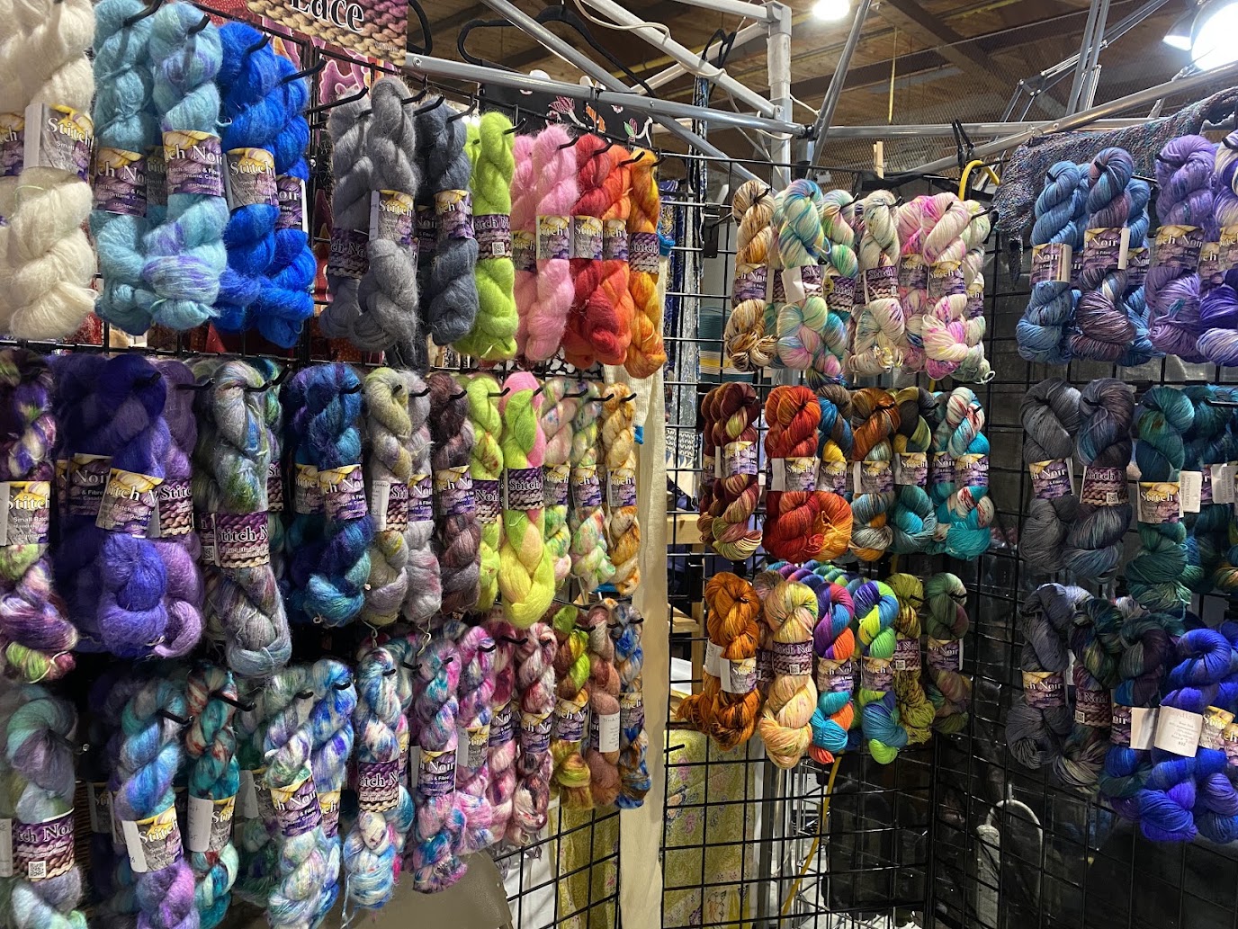 Colourful textiles arranged on a rack