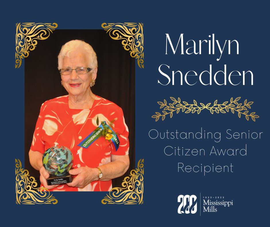 Woman holds community award
