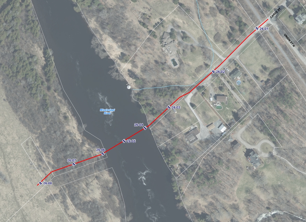 Satellite view of town with a river running through it. A red line indicates where geotechnical work will take place.