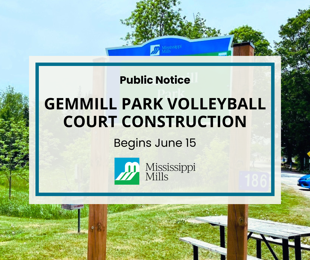 A large sign at the entrance of a park with green trees and green grass surrounding it. A picnic table sits vacant to the right of the sign. A white box with blue border has black text reading 'Public Notice - Gemmill Park Volleyball Court Construction Begins June 15.'