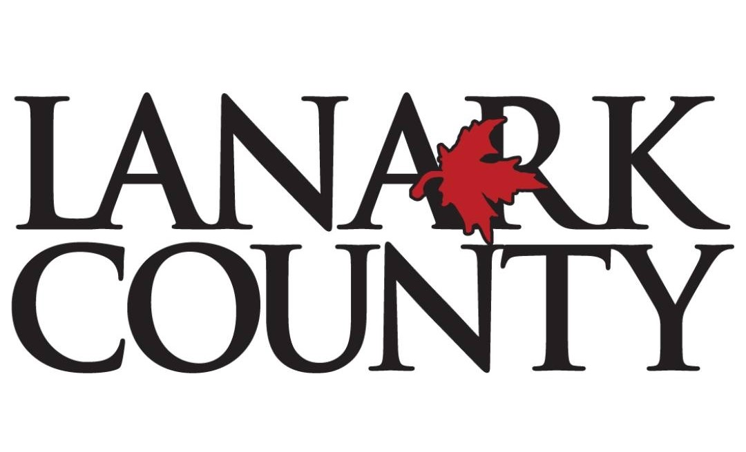 Black text logo reading 'Lanark County' with a red maple leaf in the centre