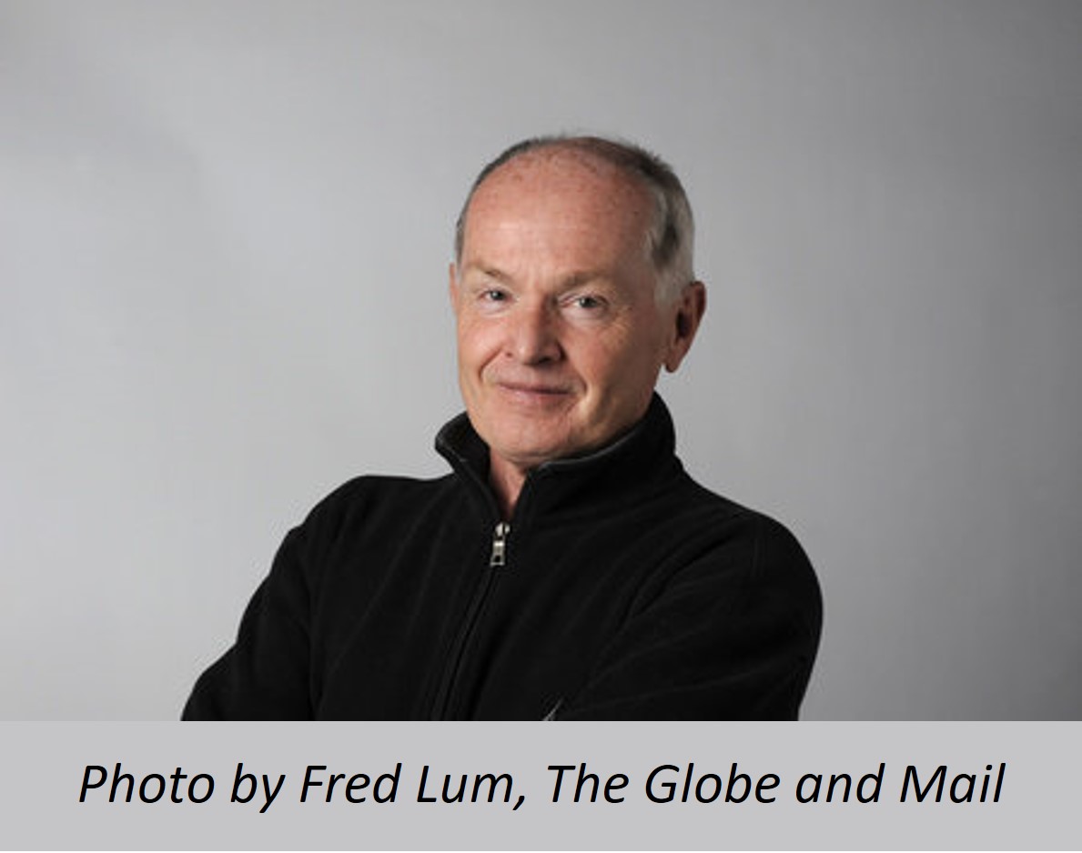 Photo of older gentleman with thinning hair wearing black sweater and smiling at the camera