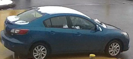 Blue four door vehicle