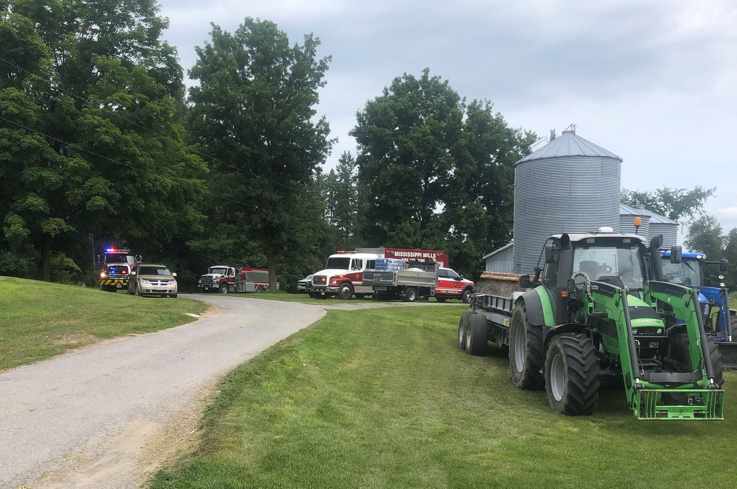 Emergency vehicles surround farm for silo fire