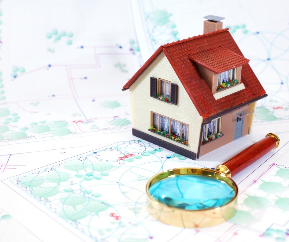 house and magnifying glass