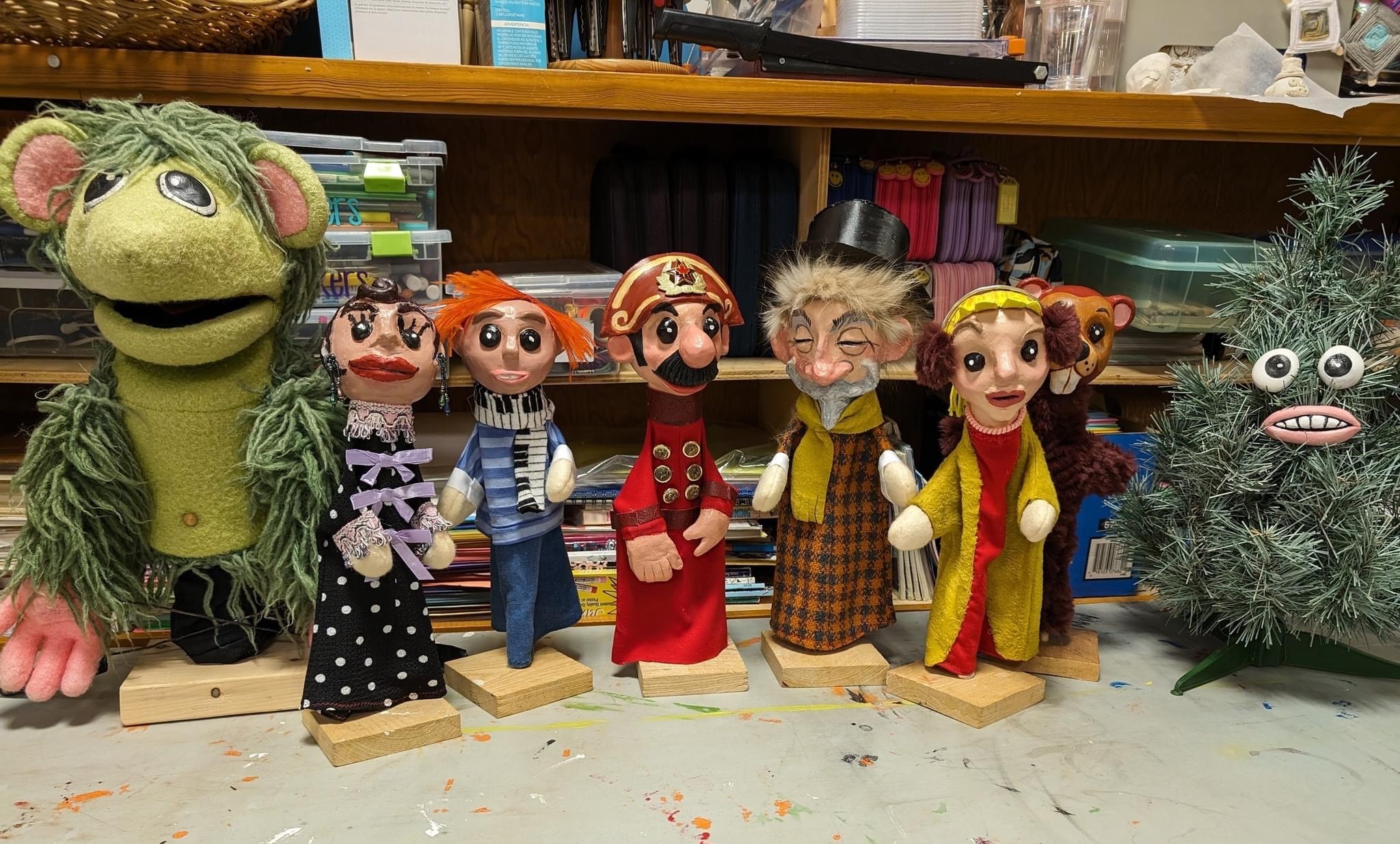 Puppets lined up on the floor