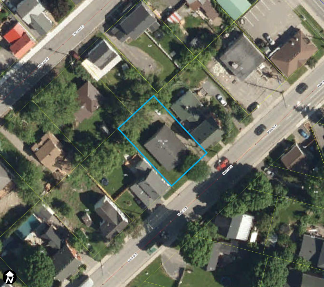 Satellite view of neighbourhood with mature trees. A blue box identifies a property.