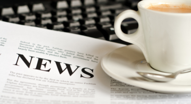 newspaper and cup of coffee