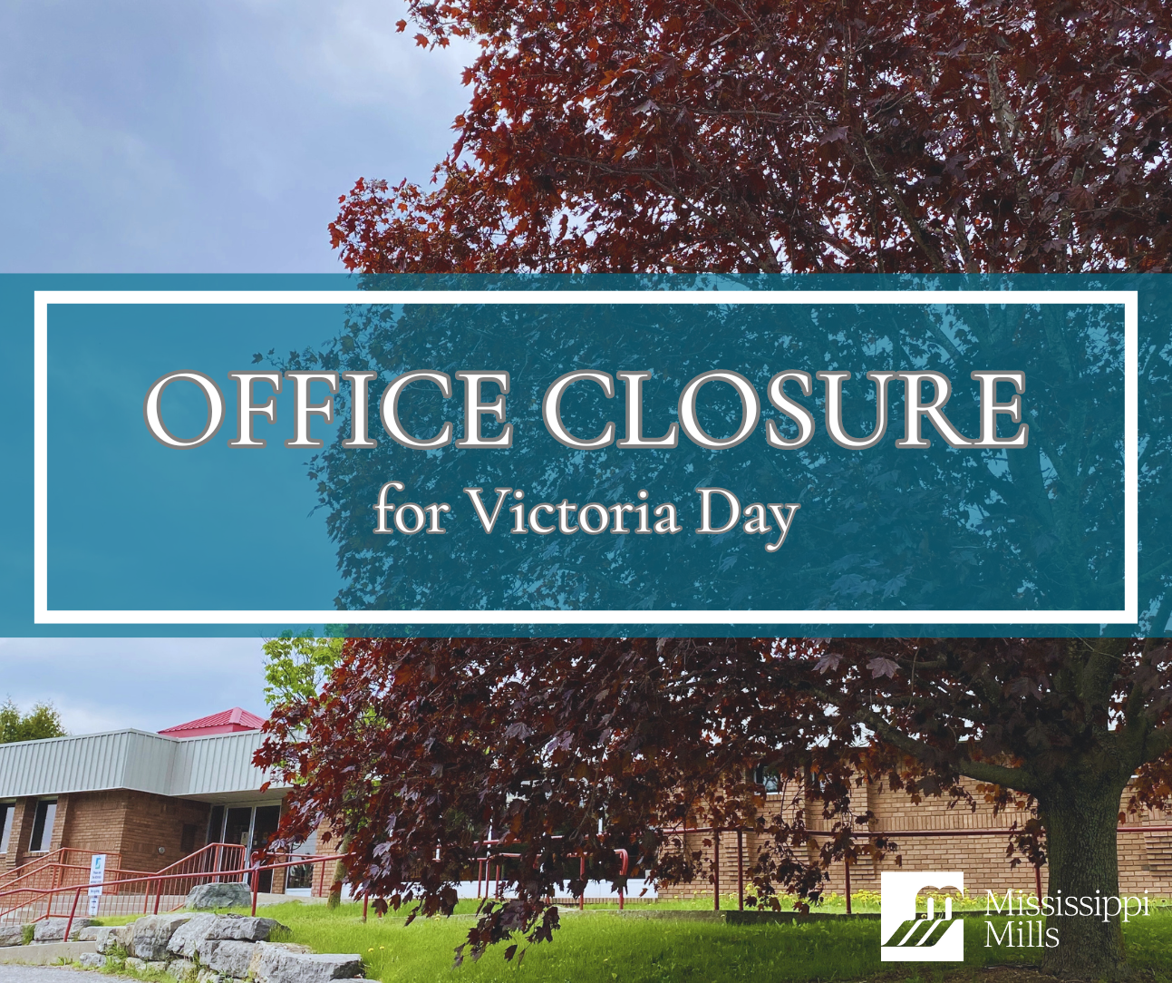 Photo of red brick building with a red maple tree in the foreground. A blue box with white text covers a portion of the photo and reads 'Office Closure for Victoria Day'