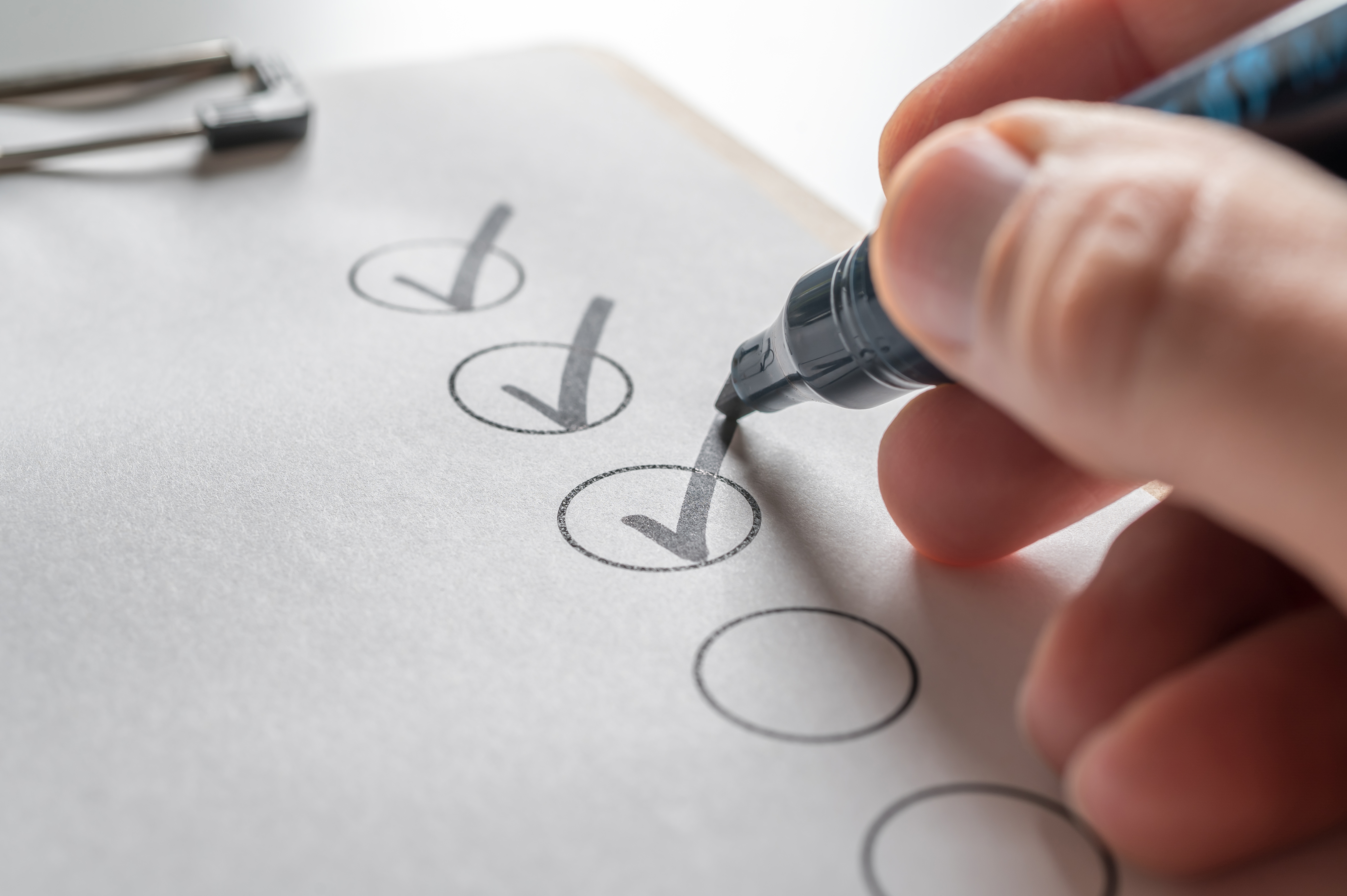 Marker Making a Checkmark on a List