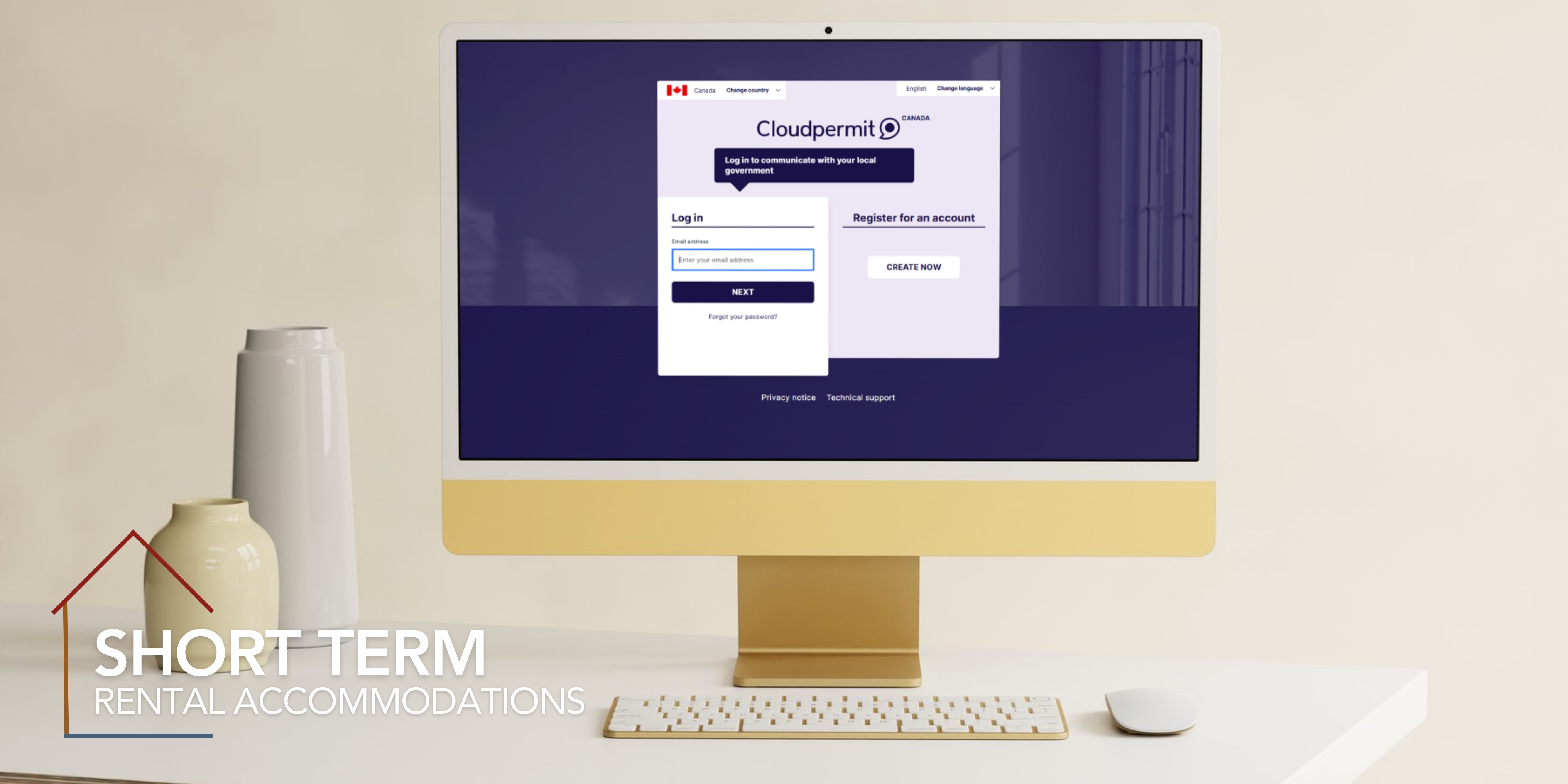 Desktop computer on desk and short term rental logo