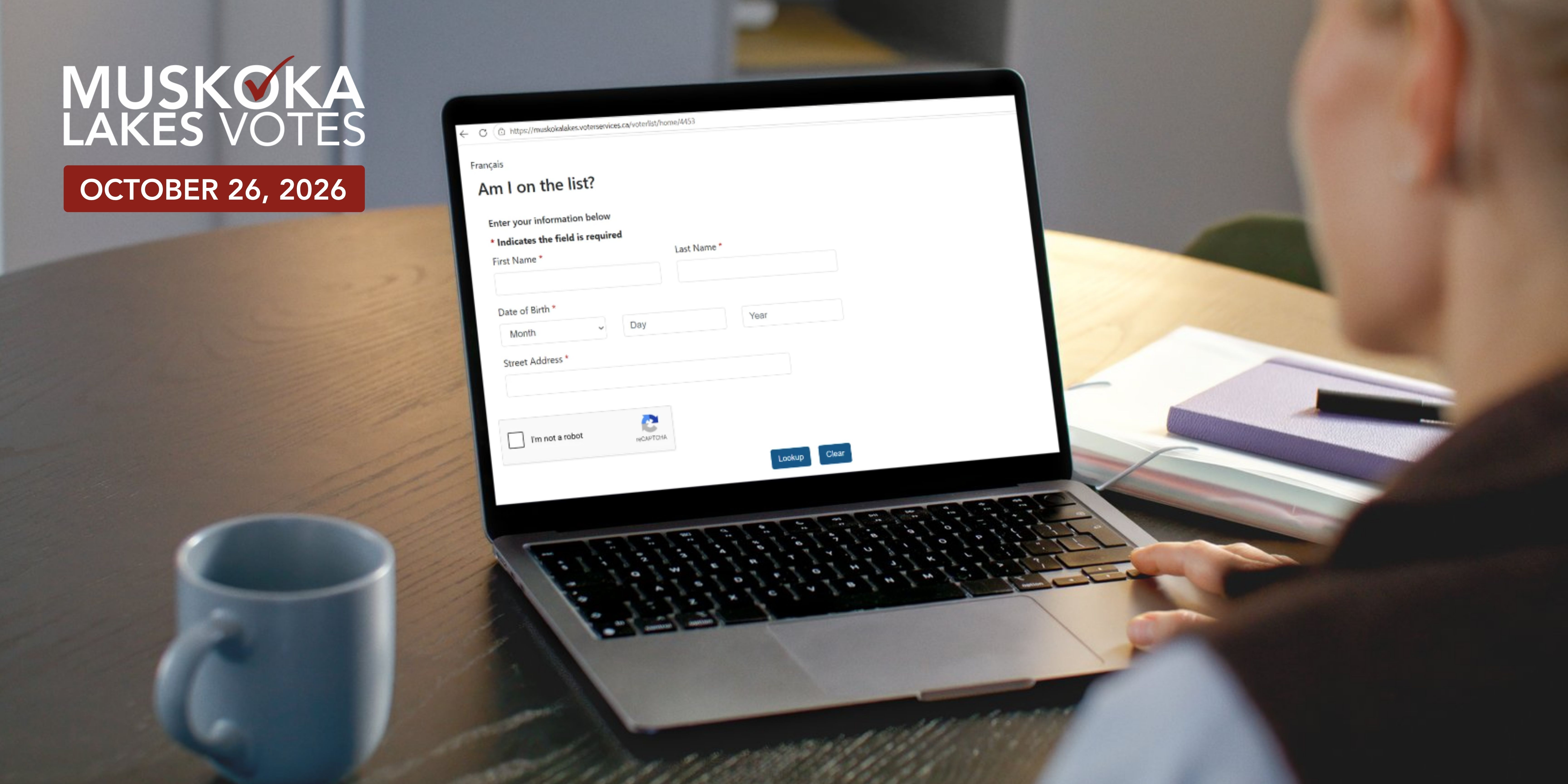 Person using computer, on the voter lookup webpage