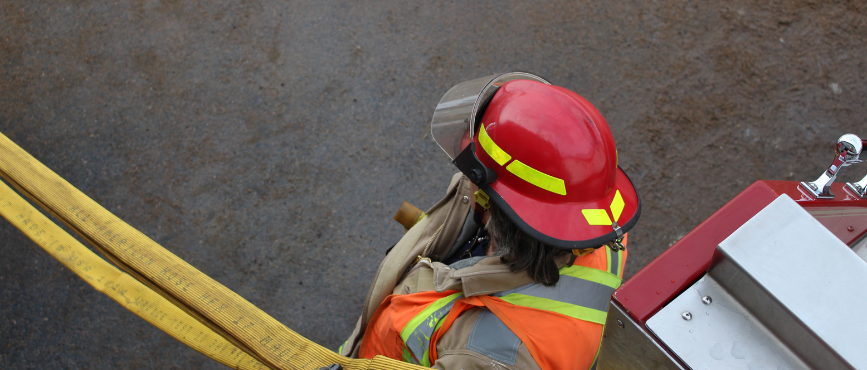 A firefighter holding a fire hose