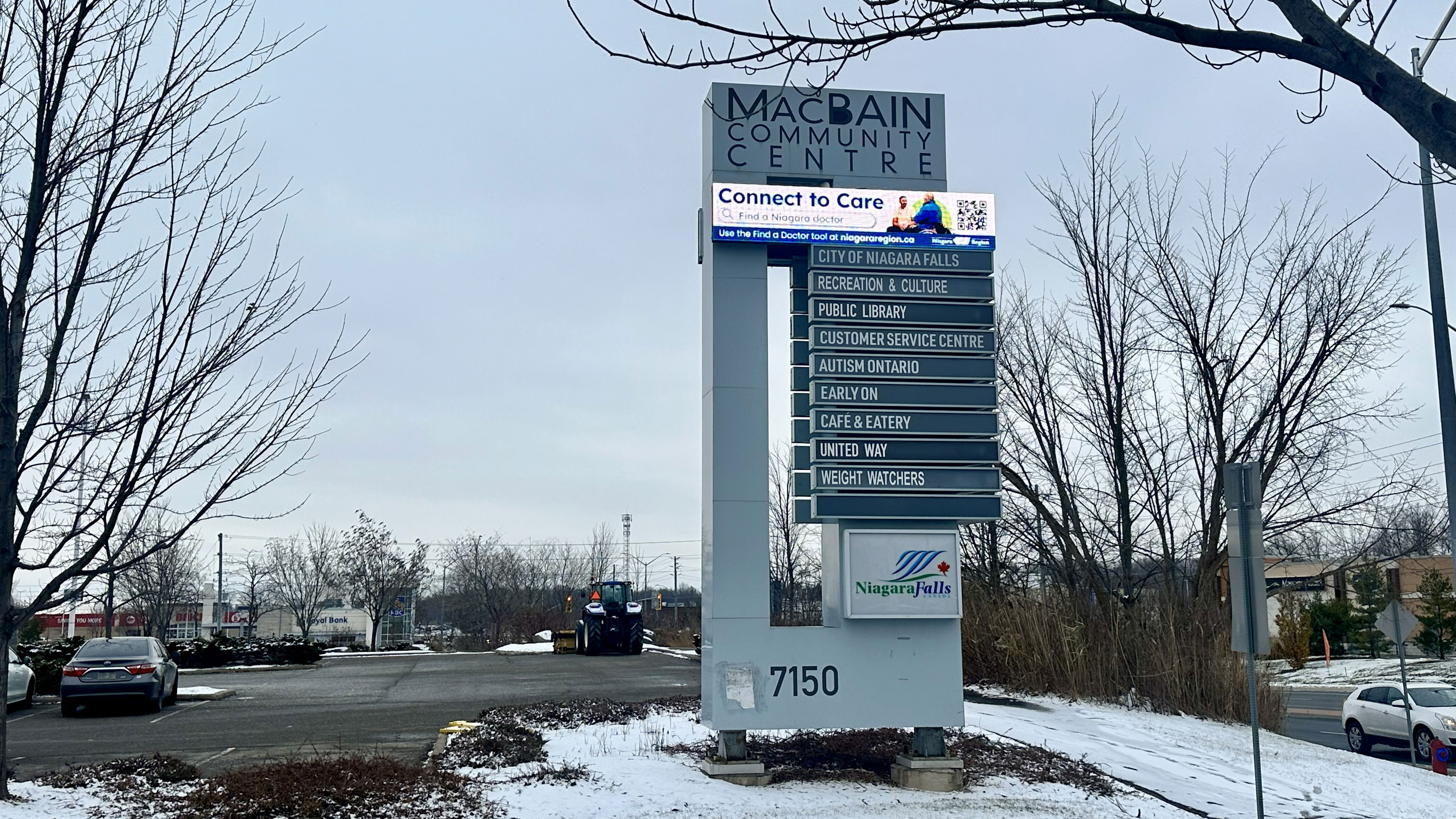 The outdoor sign at the MacBain Community Centre in Niagara Falls. It shows the digital message board near the top.