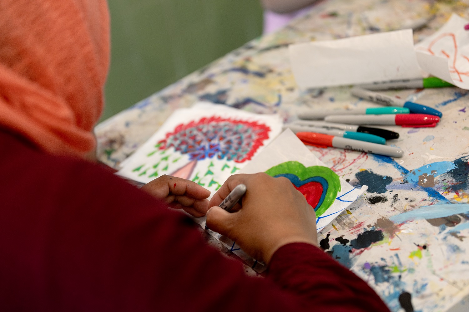 A woman drawing a heart