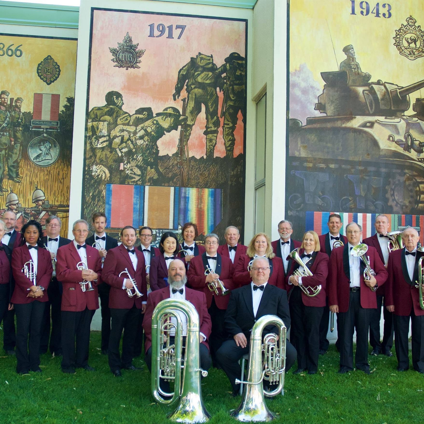 band standing in front of mural