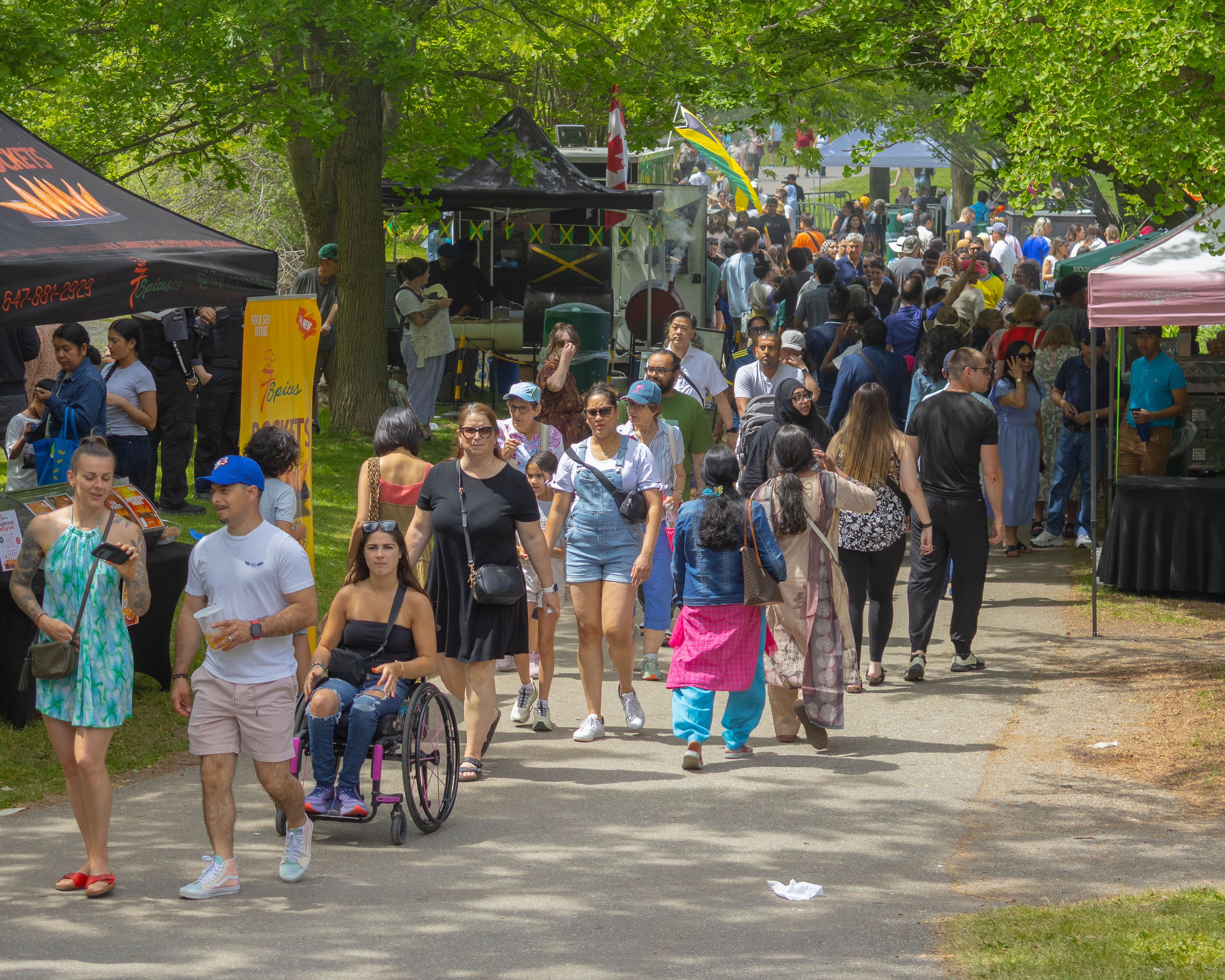 people walking through vendor market