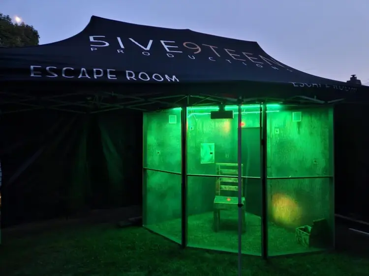 green lit chamber escape room attraction