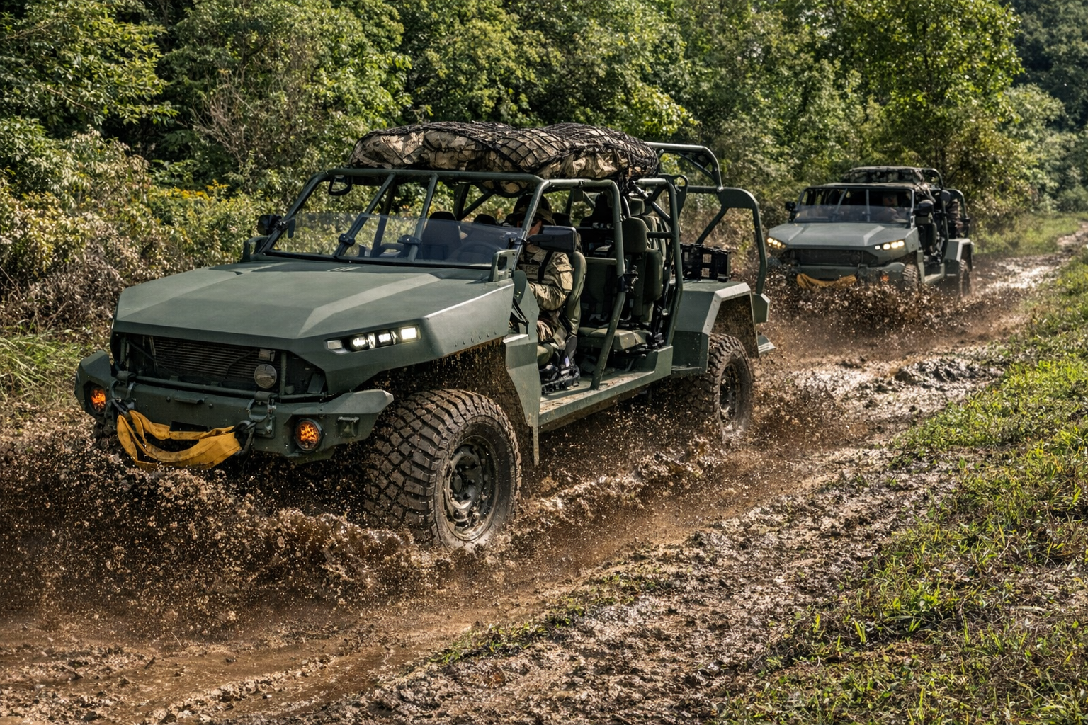 GM Defence Canada vehicles going driving through the mud.