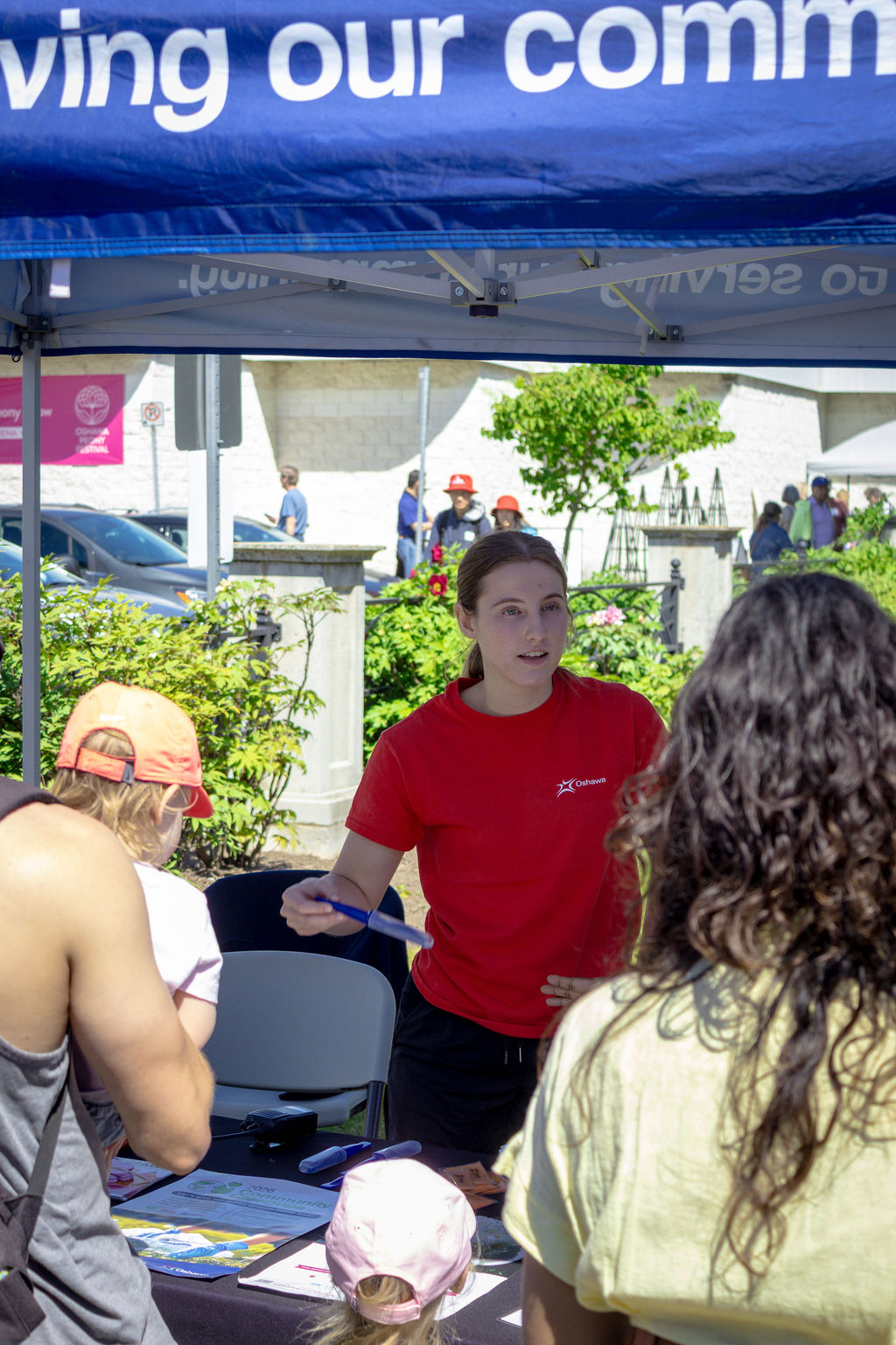 City representative at info table talking to visitors