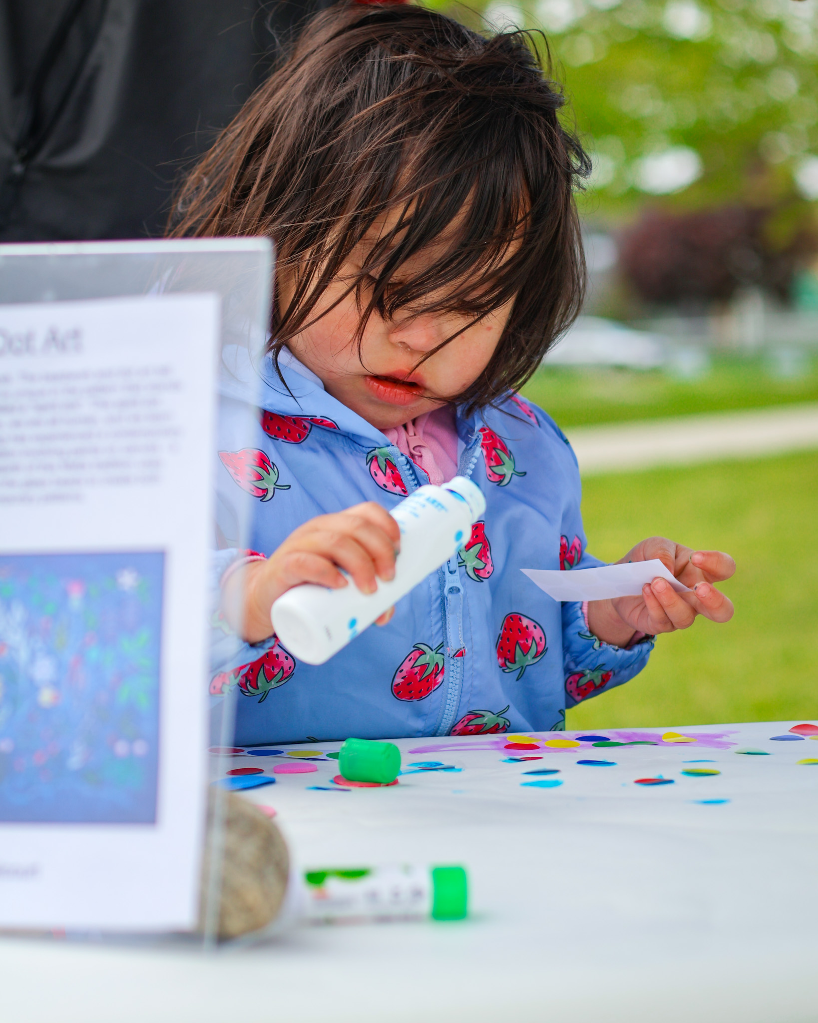 child using markers on paper