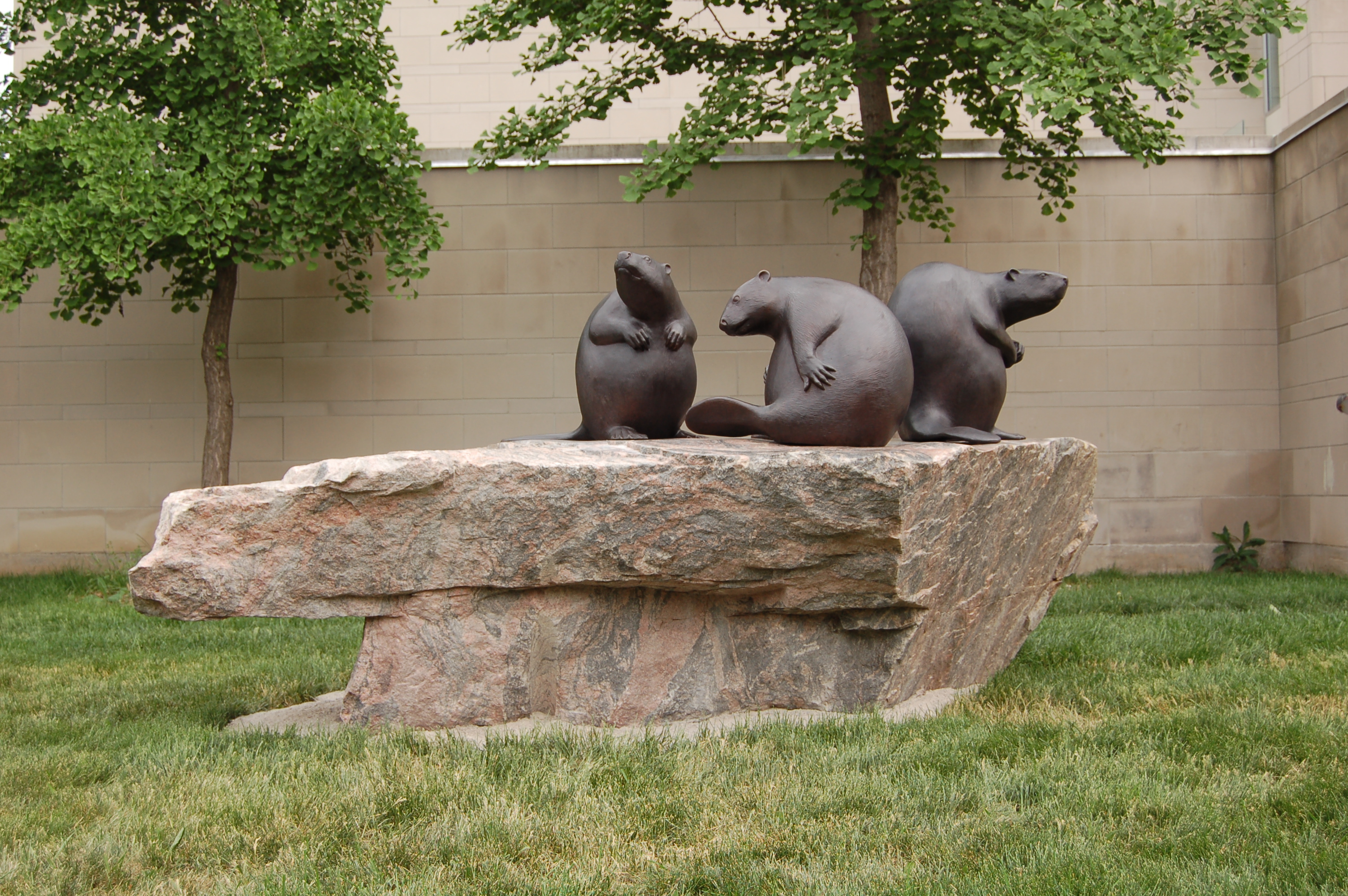 Public art sculpture of three beavers on a rock in front of the RMG