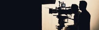 Person behind a film camera 